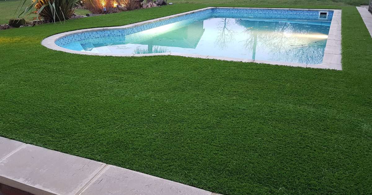Professional landscaping works completed artificial turf installation around swimming pool - Oakland Group, Landscaping Services.