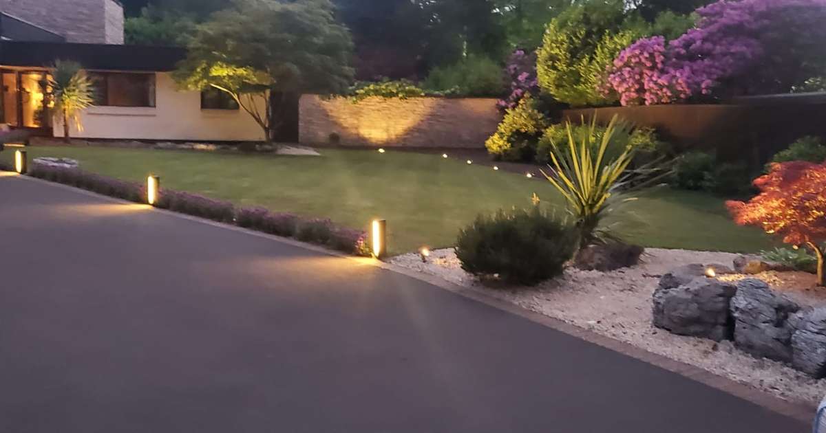 12v outdoor garden lighting installation completed in Sutton Coldfield. Low voltage outdoor lighting fixtures installed in front landscape - Oakland Group, Outdoor Garden Lighting Design and Installation Services.