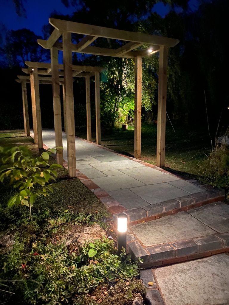 12v outdoor garden lighting design to installation results. Cottage garden path and pergola lighting and tree beautifully illuminated with high quality outdoor lights from in-lite - Oakland Group, Outdoor Garden Lighting Design and Installation Services.