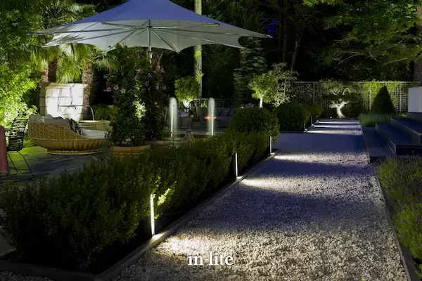 Large 18th century country house and rear landscaped gardens at night exquisitely illuminated by in-lite Outdoor Lighting.