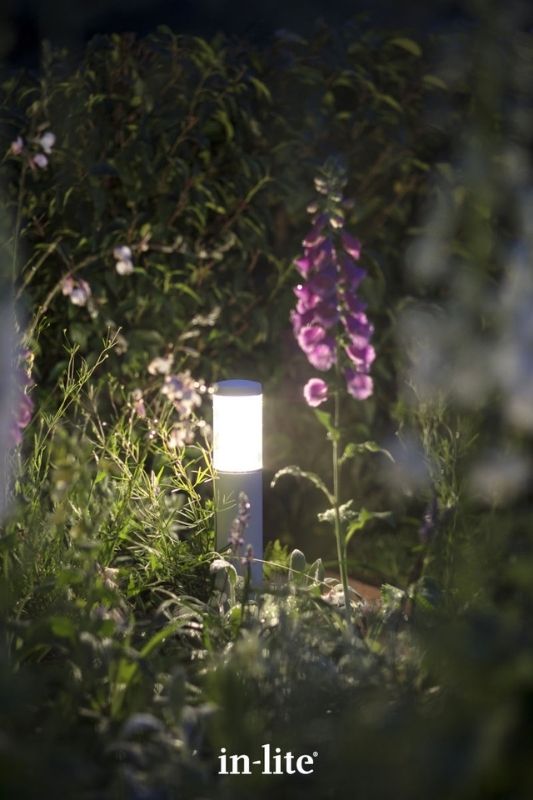 in-lite LIV LOW 12v outdoor bollard light illuminating plants with an atmospheric lighting effect all round the border. Low voltage outdoor garden lights, atmospheric lighting for ambiance.