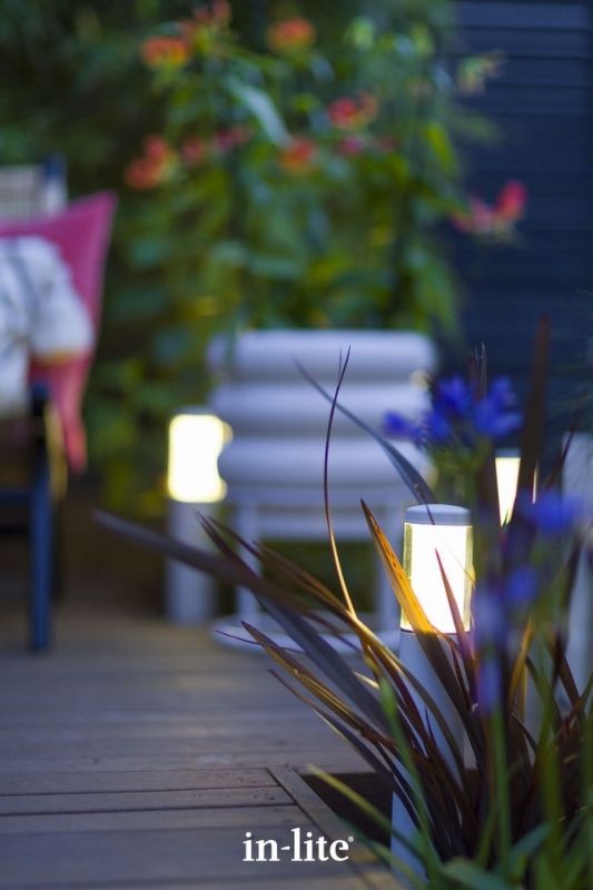 in-lite LIV LOW 12v outdoor bollard lights, installed in decking borders, illuminating plants with an atmospheric lighting effect all round the borders. Low voltage outdoor garden lights, atmospheric lighting for ambiance.