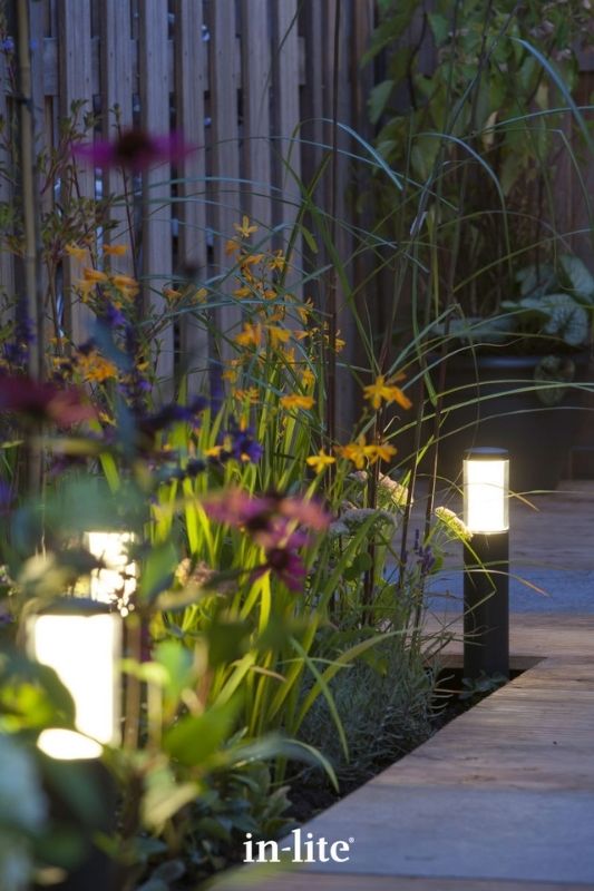 in-lite LIV LOW DARK 12v outdoor bollard lights, installed in decking borders, illuminating plants with an atmospheric lighting effect all round the borders. Low voltage outdoor garden lights, atmospheric lighting for ambiance.