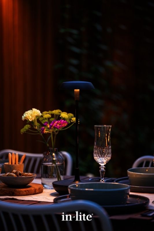 in-lite SWAY TABLE 12v outdoor wireless table light illuminating alfresco dining space with a soft ambient light spread downwards. Low voltage outdoor garden lights, atmospheric lighting for ambiance.