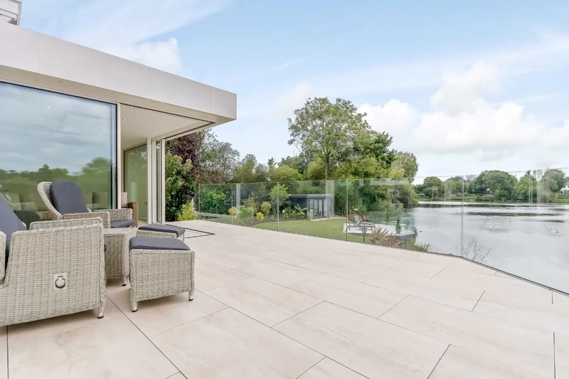 Lakeside balcony terrace with outdoor porcelain tiles installed on the iGarden light steel subframe foundation system built and raised off the ground.