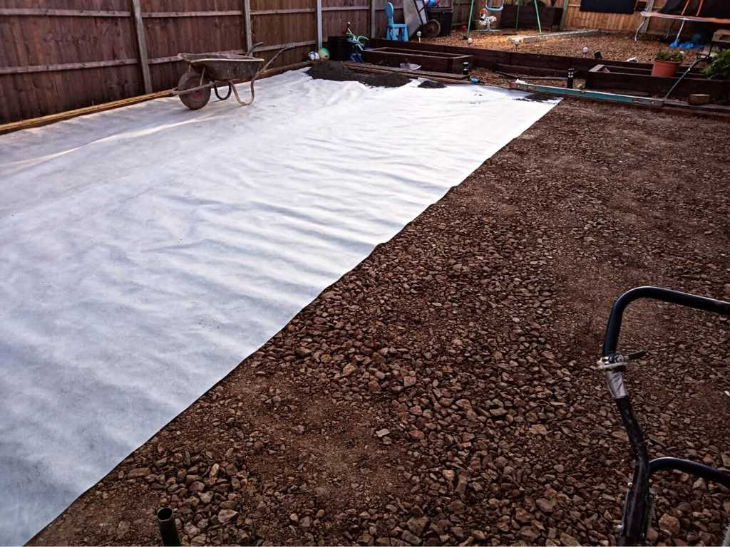 Landscape garden artificial grass lawn installation groundworks compacted hardcore, grano dust and membrane in Kings Heath, Birmingham - Oakland Group.