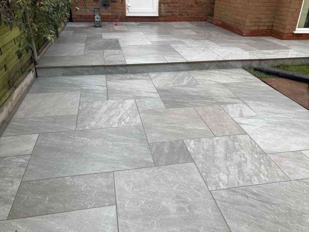 Low maintenance garden patio outdoor porcelain installed in Solihull, West Midlands - Oakland Group.
