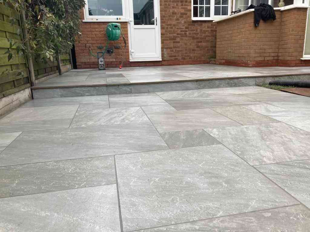 Low maintenance garden patio outdoor porcelain installed in Solihull, West Midlands - Oakland Group.