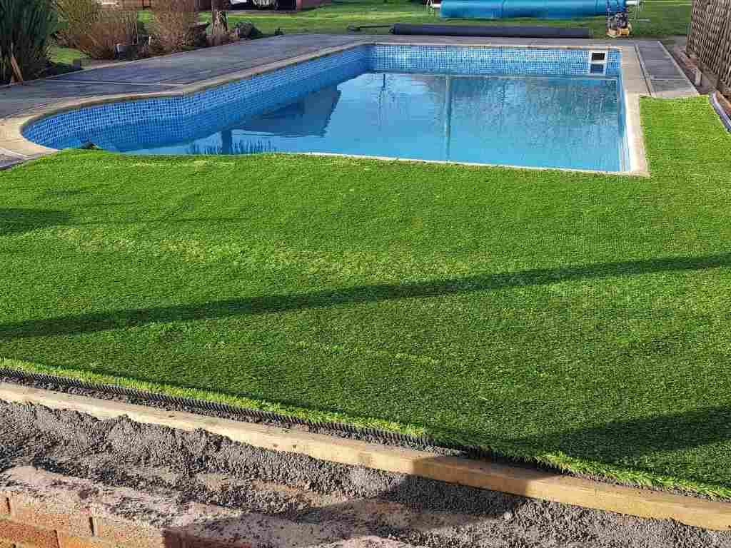Landscape garden renovation artificial turf installation on pool landscaping project in Shrewley, Warwick - Oakland Group.