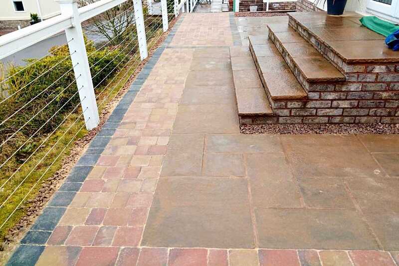 Domestic landscape garden transformation with decorative block paving and slabbing patio installation works at Broadwell Woods Residential Park in Burton Green, Kenilworth - Oakland Group.
