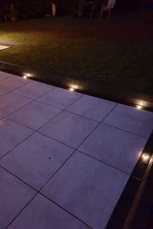 Safe Low Voltage Outdoor Lighting recessed in paving along patio edge creating indicative lighting and ambient effects.
