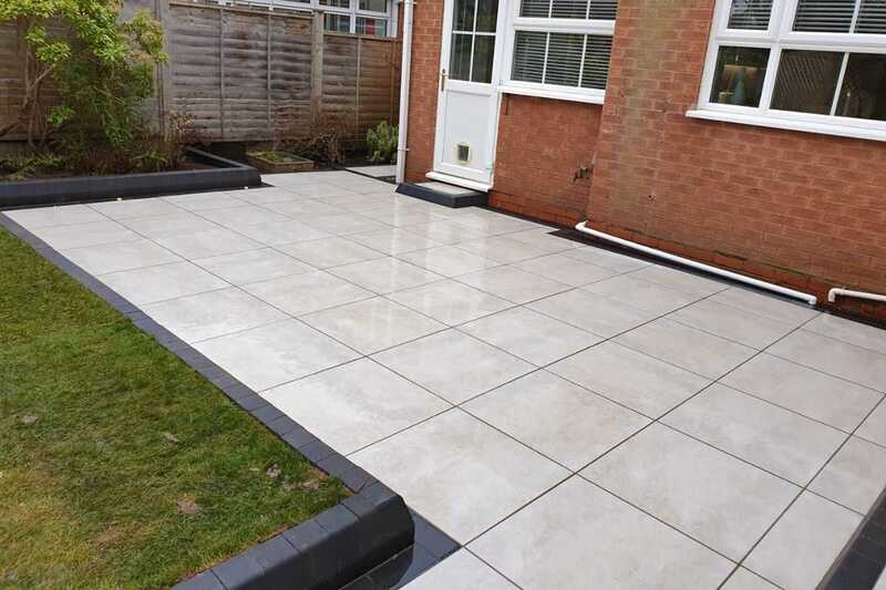 Metro Grey outdoor tiles installed with block edge in contemporary style porcelain patio outdoor space.