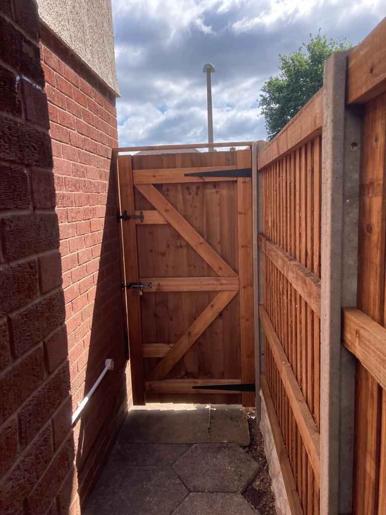 New garden gate replacement with fencing supplied and fitted by landscape installation team in Damson Parkway, Solihull - Oakland Group.