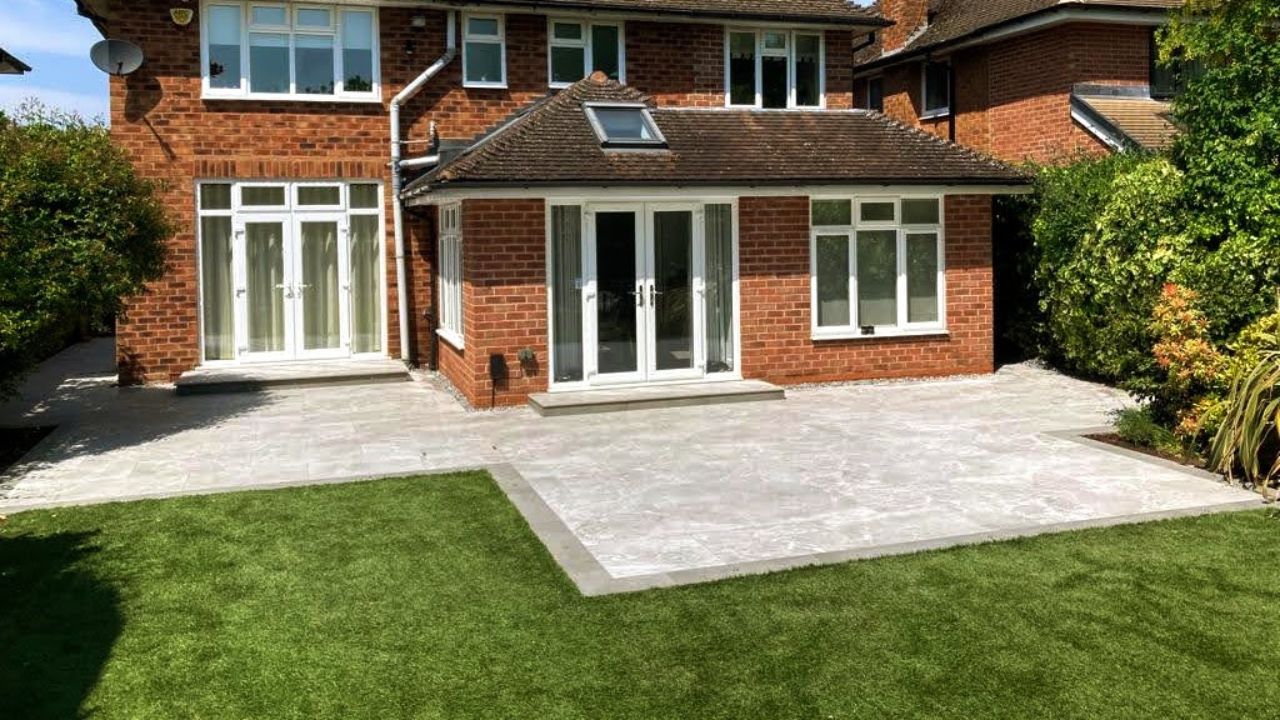 Landscaping works completed in Dorridge Solihull. Contemporary home rear extension porcelain patio and low voltage outdoor lighting installed.