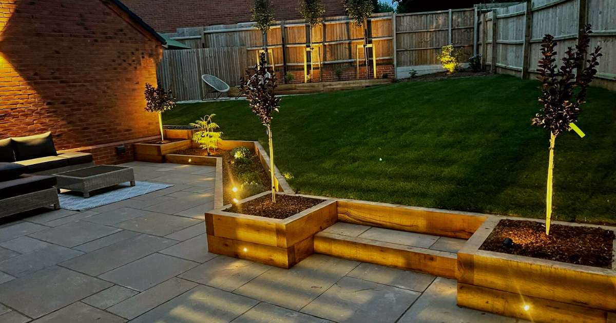 Professional landscaping works completed new patio, raised sleeper beds, planting, low voltage outdoor garden lighting installation - Oakland Group, Landscaping Services.
