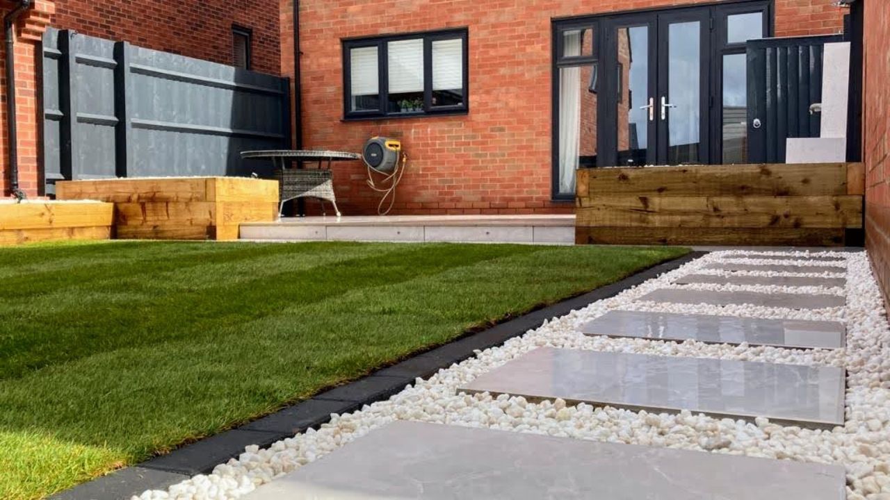 Landscaping works completed in Hockley Heath Solihull. Porcelain patio and pathway, block edge along new turf installed. Low voltage outdoor lighting installed.