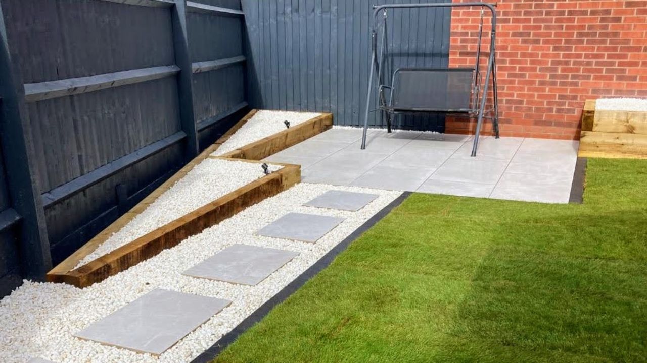 Landscaping works completed in Hockley Heath Solihull. Porcelain patio and pathway, block edge along new turf installed. Low voltage outdoor lighting installed.