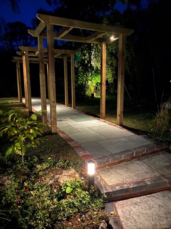 Landscaping works completed in Nether Whitacre Birmingham. New natural stone pathway, pergola and low voltage 12v outdoor lighting installed in garden.