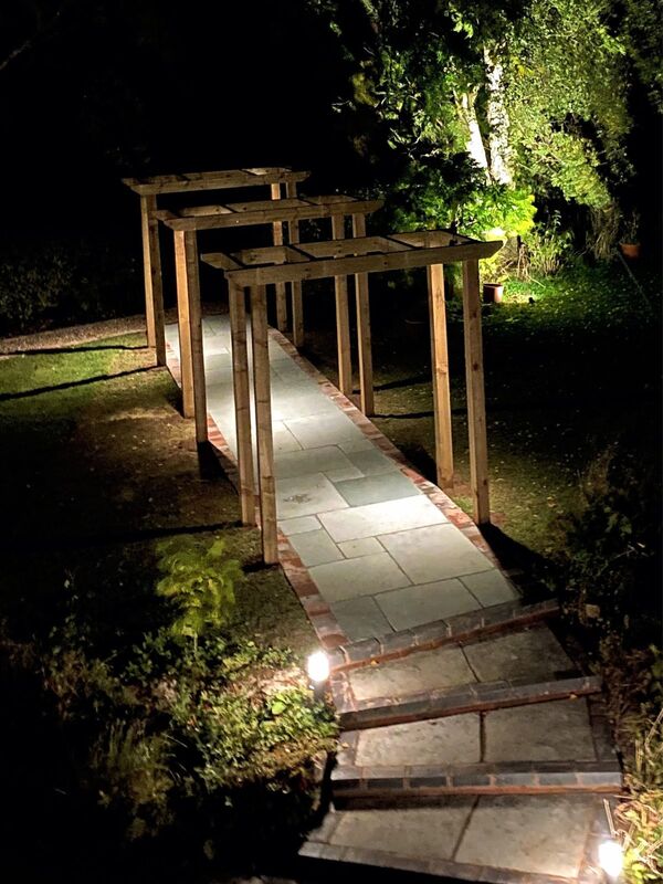 Landscaping works completed in Nether Whitacre Birmingham. New natural stone pathway, pergola and low voltage 12v outdoor lighting installed in garden.