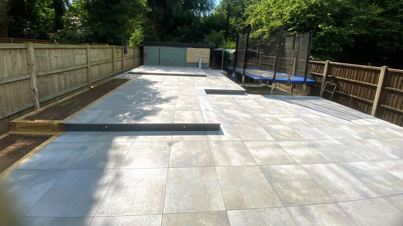 Landscaping works completed in Olton Solihull. Light steel patio sub frame system with outdoor porcelain tiles installed in rear garden.