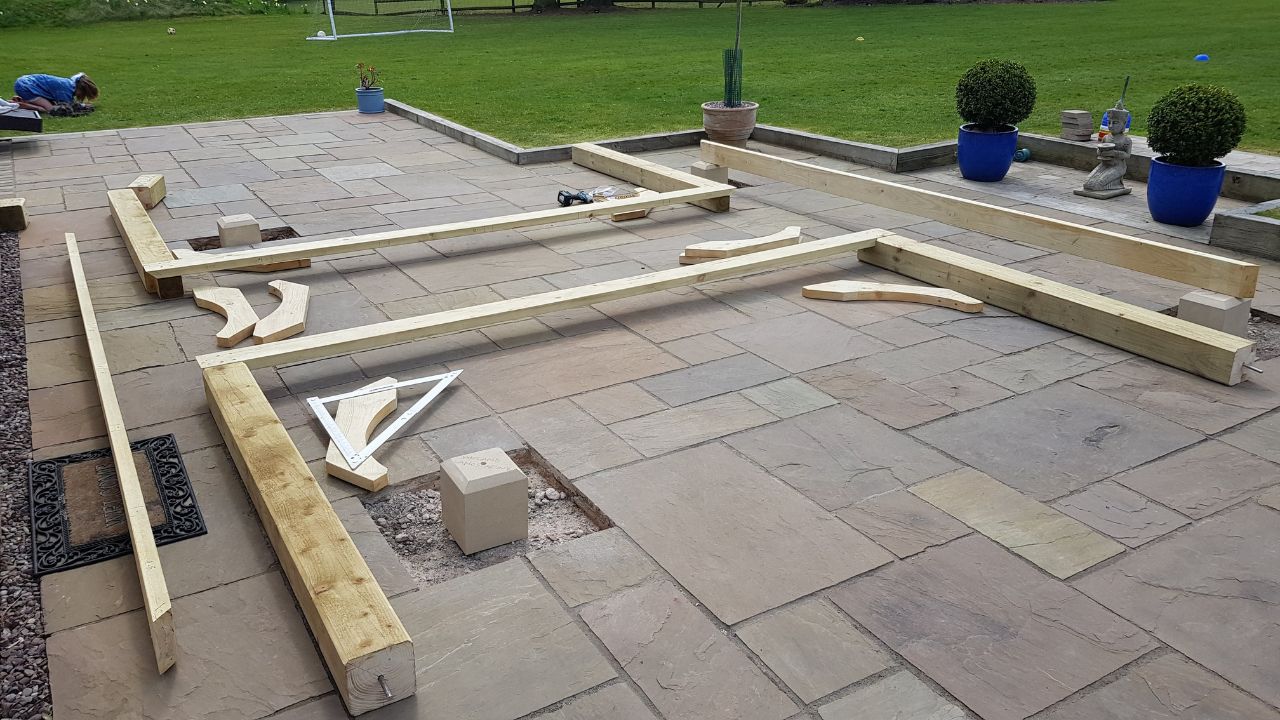 Landscaping works in progress in Rowington Warwick. Concrete footings in place and gazebo corner post timbers laid out in preparation for gazebo construction.