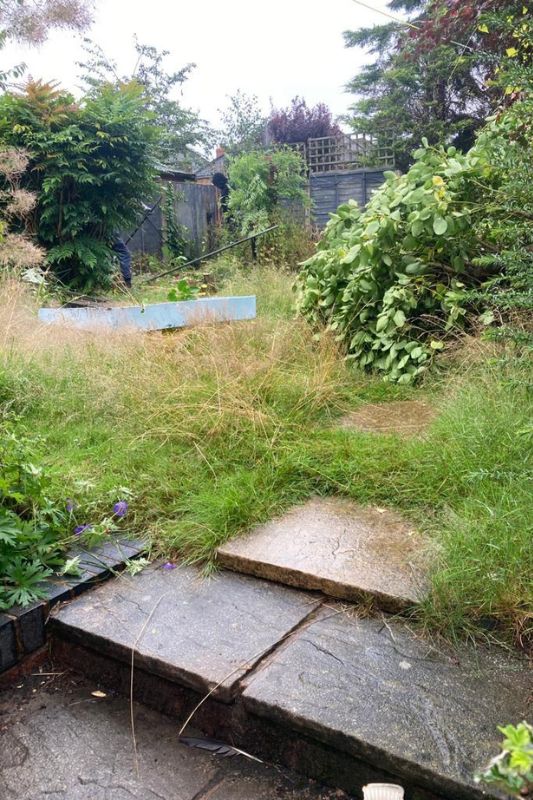 Landscape garden before landscaping works in Solihull. Overgrown garden upper level with unkept lawn and borders overgrown plants and old fence panels.