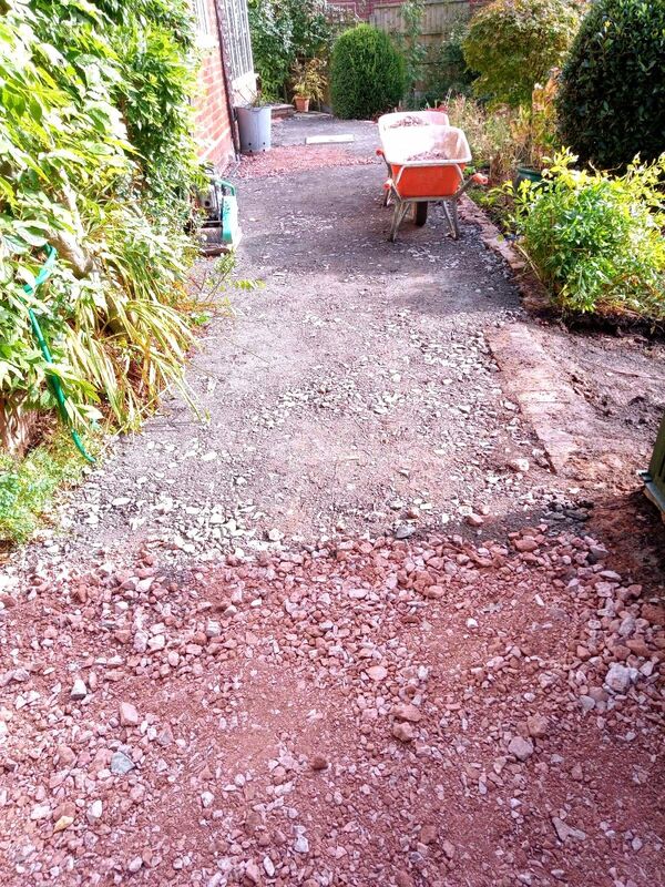 Landscaping works in progress in Solihull. Compressed hardcore foundation laid in preparation for new patio works.