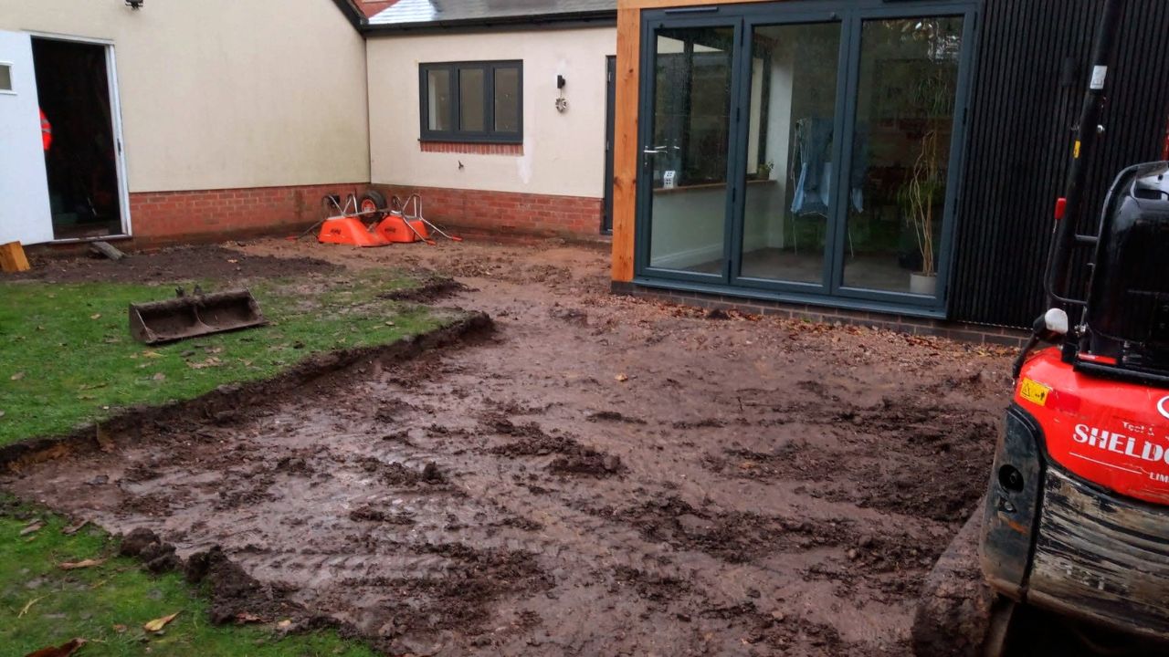 Landscape garden before landscaping works in Stratford upon Avon. New build rear extension with bi-fold doors.