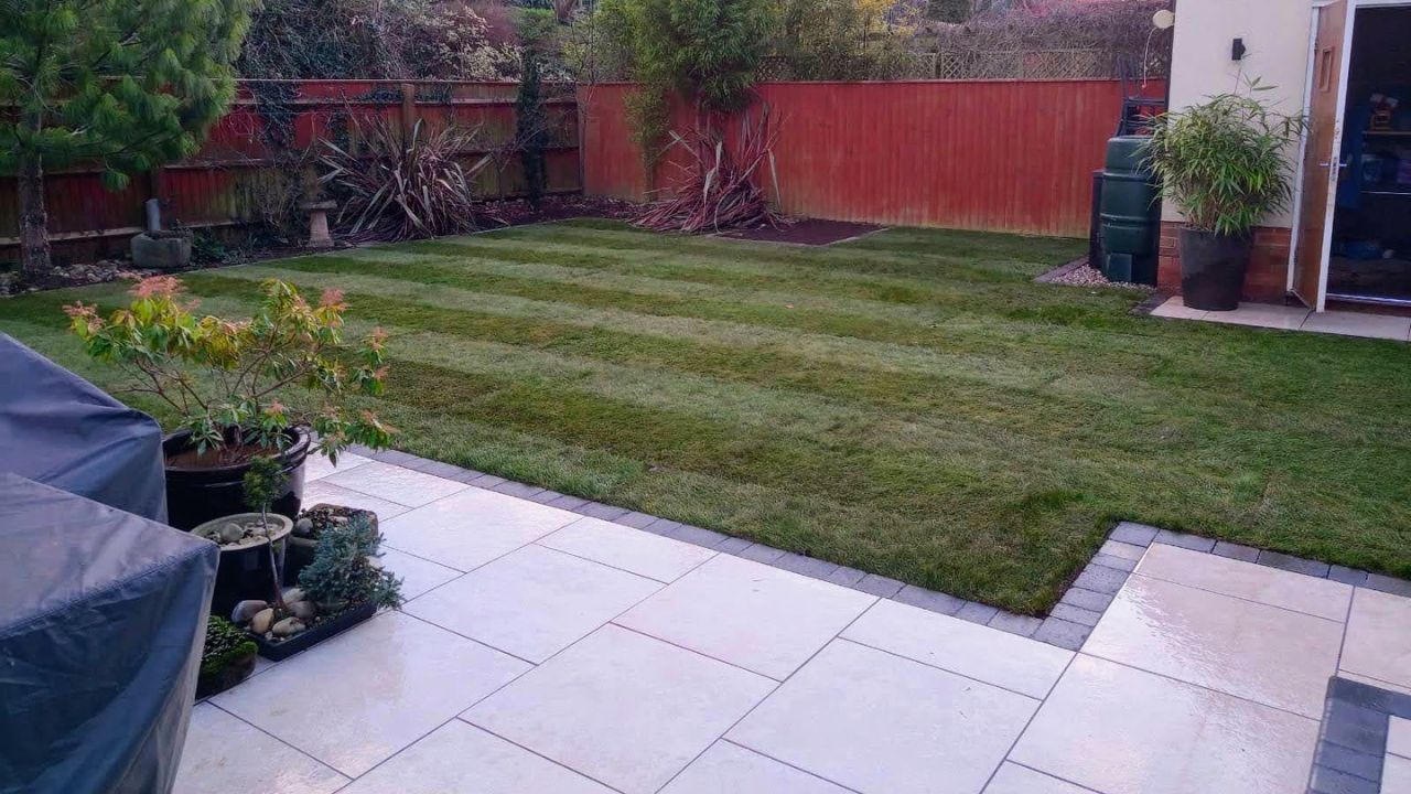Landscaping works completed in Stratford upon Avon. Porcelain patio with block edge along new turf installed.
