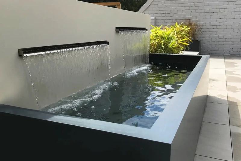 Large terrace outdoor grp water trough and cascading water blades installed using the iGarden light steel subframe foundation system.
