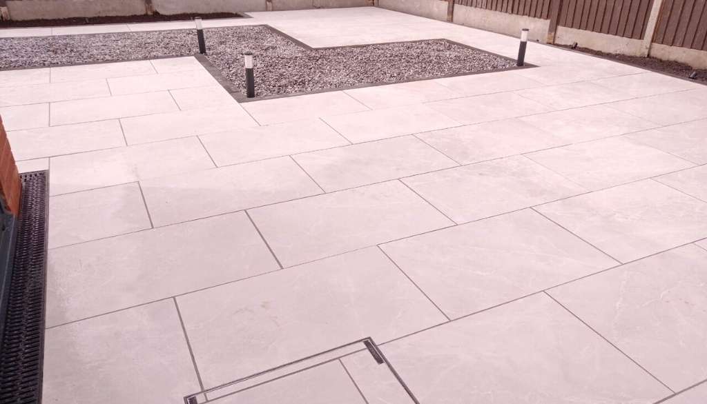 Porcelain patio and low voltage garden lighting for outdoor living space in Dorridge, Solihull - Oakland Group.