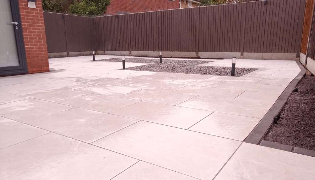 Porcelain patio and selection of low voltage garden lights for outdoor living space in Dorridge, Solihull - Oakland Group.