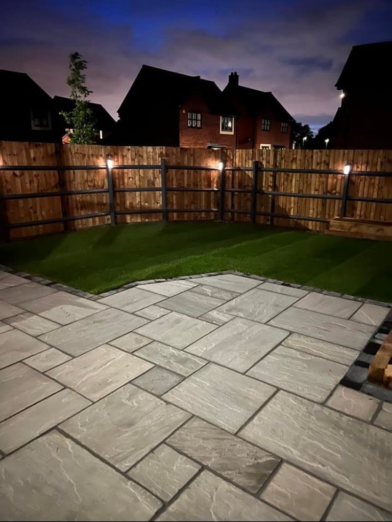 New build home garden makeover in the eving with outdoor lighting, landscaping project at Bloor Homes, Blythe Valley in Hockley Heath, Solihull - Oakland Group.