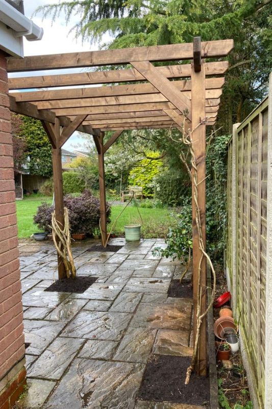 Landscaping works. Pergola replacement and installation in Knowle, Solihull. Pergola installed in ground footings along garden patio.
