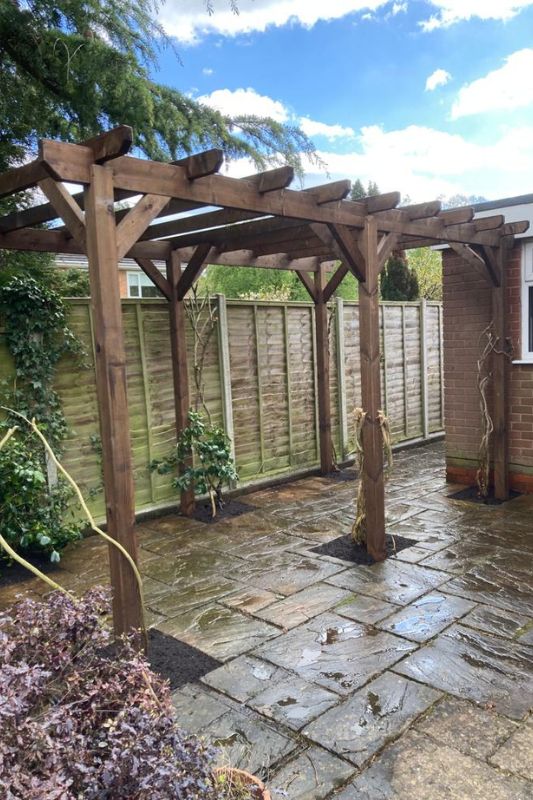 Landscaping works. Pergola replacement and installation in Knowle, Solihull. Pergola installed in ground footings along garden patio.