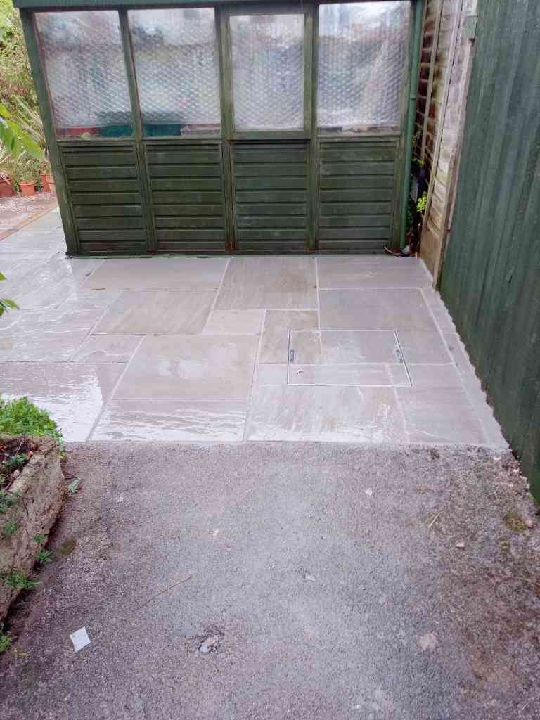 New garden greenhouse paving area after patio works in Solihull - Oakland Group.